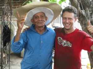 Grandpa Manuel and I take a break from the manual labour. How did I get so dirty?