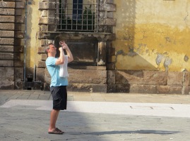 Shaun takes a photo of a cathedral in Lucca.